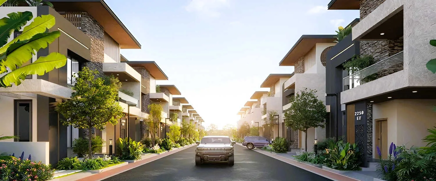 Nambiar Bannerghatta villa streetscape with exposed-brick facades along a 12 m internal road